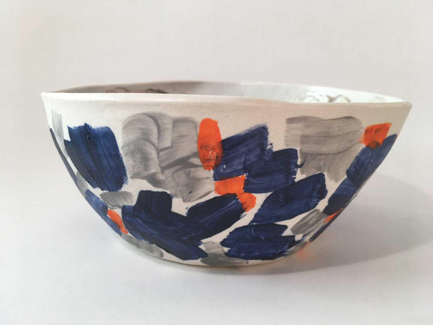 Porcelain Bowl with Grey, Blue, and Orange Marks