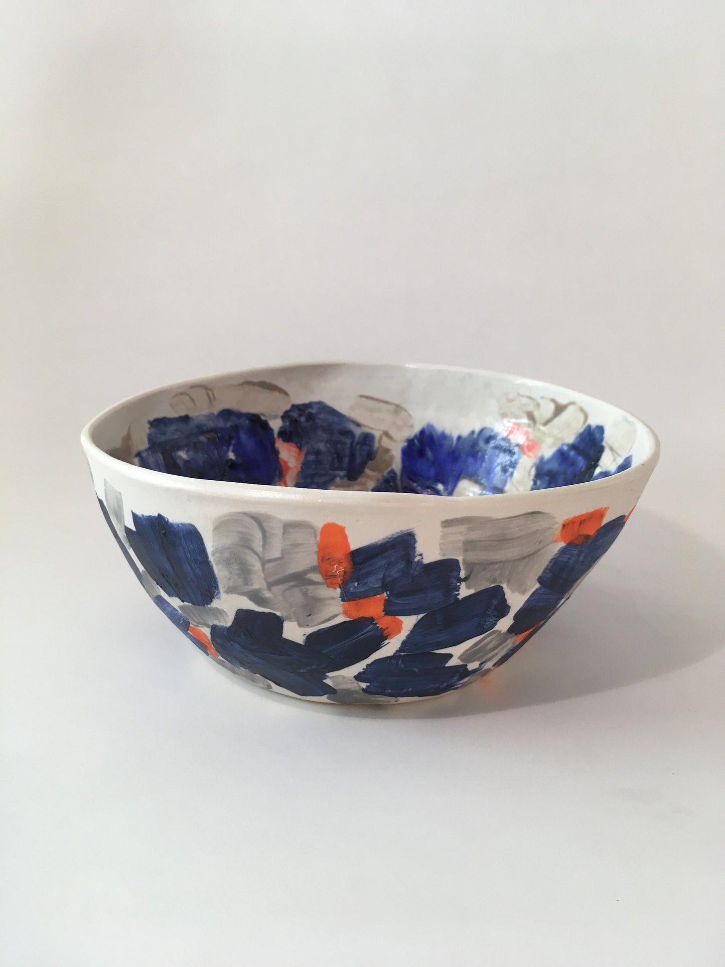 Porcelain Bowl with Grey, Blue, and Orange Marks