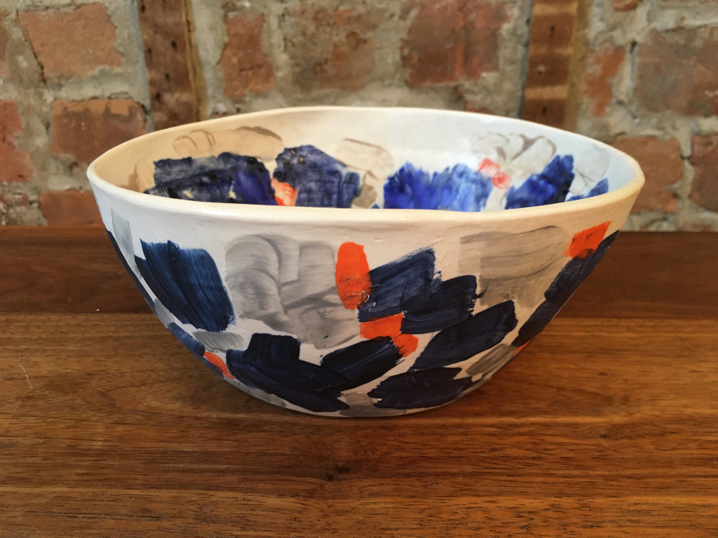 Porcelain Bowl with Grey, Blue, and Orange Marks