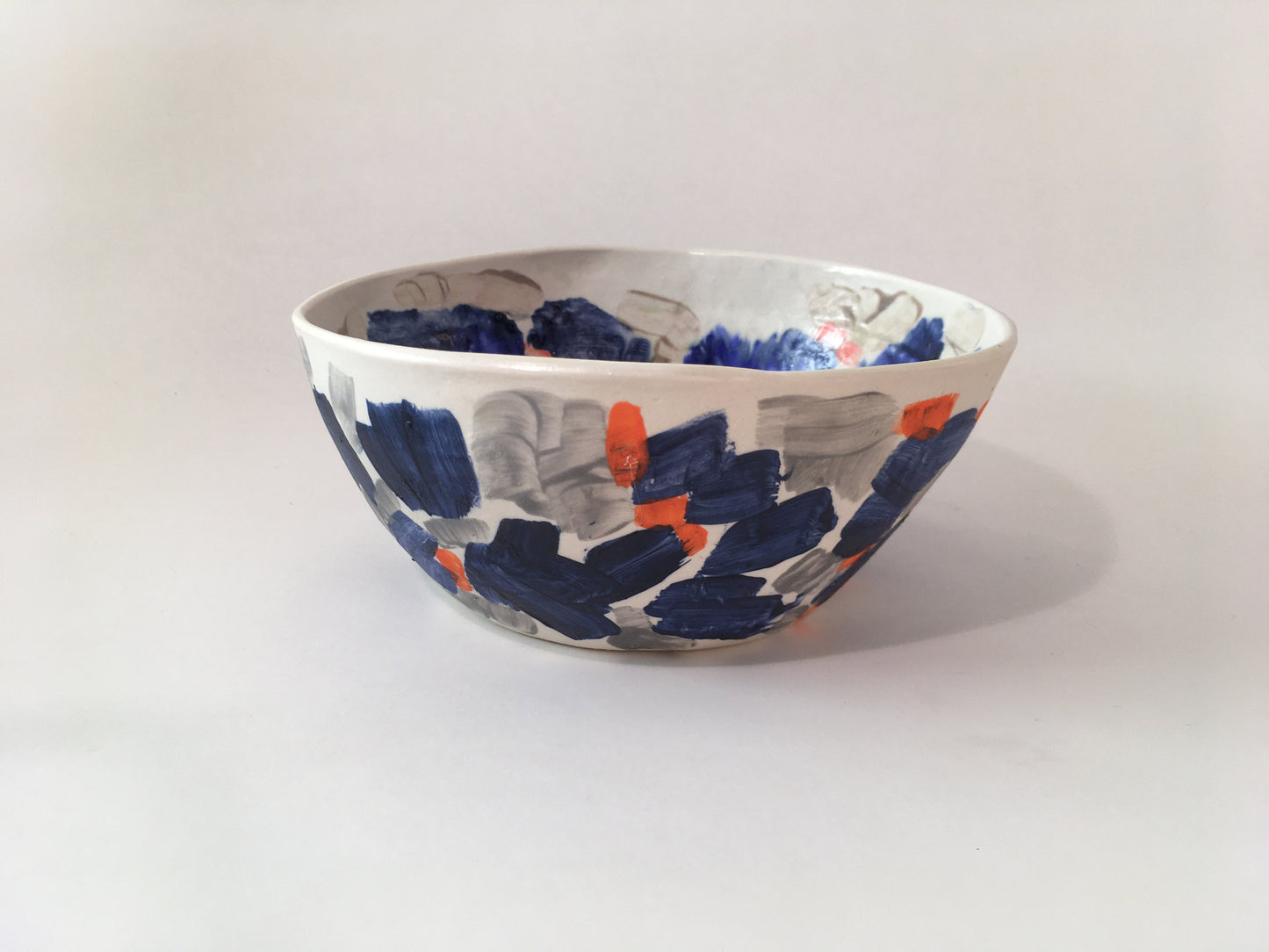 Porcelain Bowl with Grey, Blue, and Orange Marks