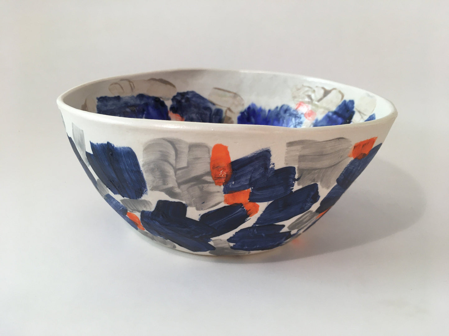 Porcelain Bowl with Grey, Blue, and Orange Marks