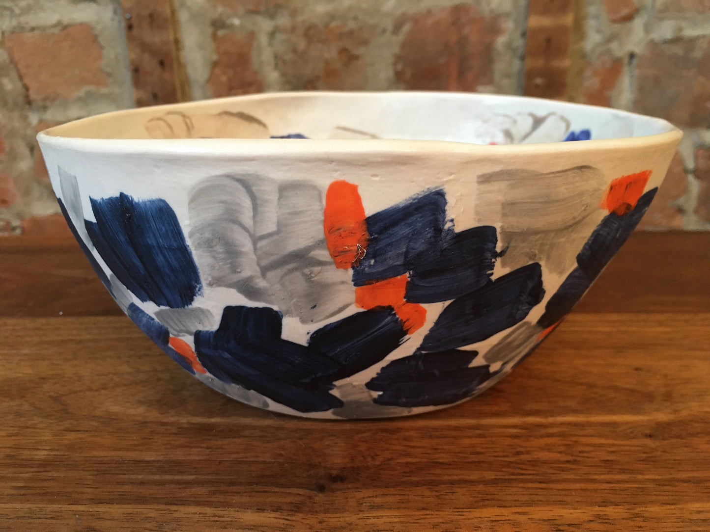 Porcelain Bowl with Grey, Blue, and Orange Marks